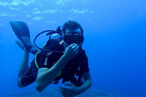 Scuba Diver Equalizing His Ears