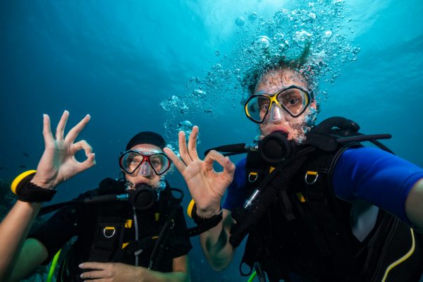 Divers Showing OK Sign