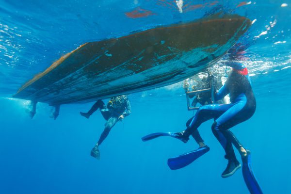 Divers Climbing Up Ladder